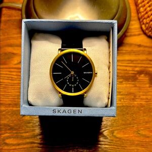 Elegant black and gold Skagen watch